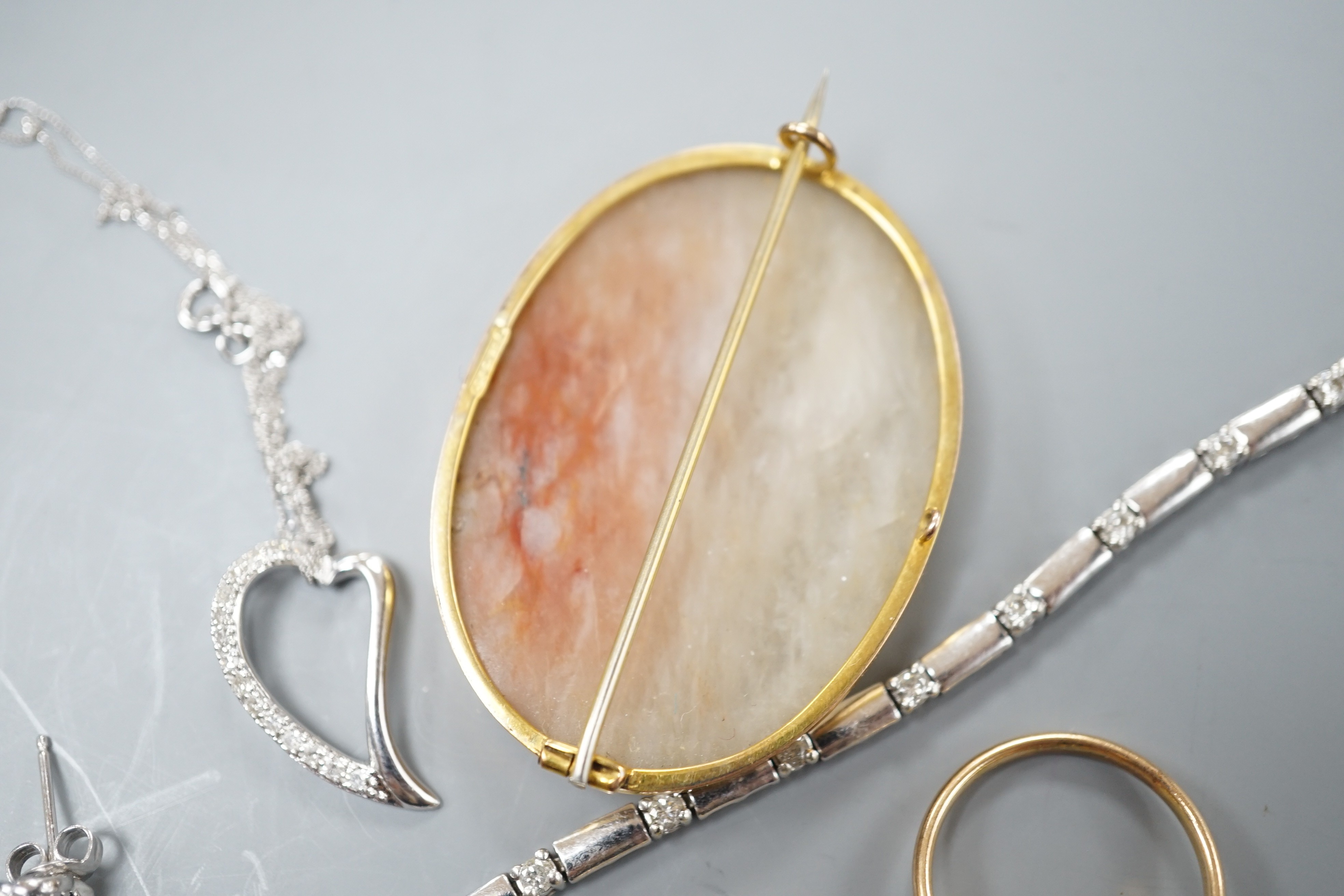 A 9kt white metal and diamond set bracelet, a 9ct mounted agate brooch, two rings including 18k, two pendants and a pair of modern diamond set ear studs.